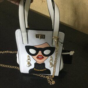 NWT purse comes with two crossbody straps a chain and a white  top handle